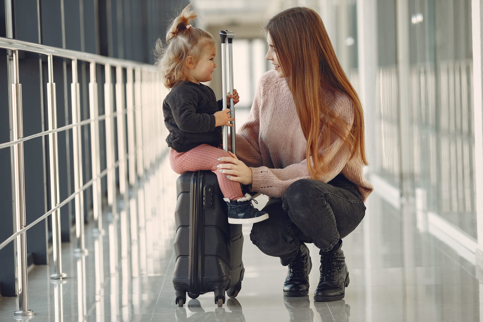 A mom and her toddler at the airport.