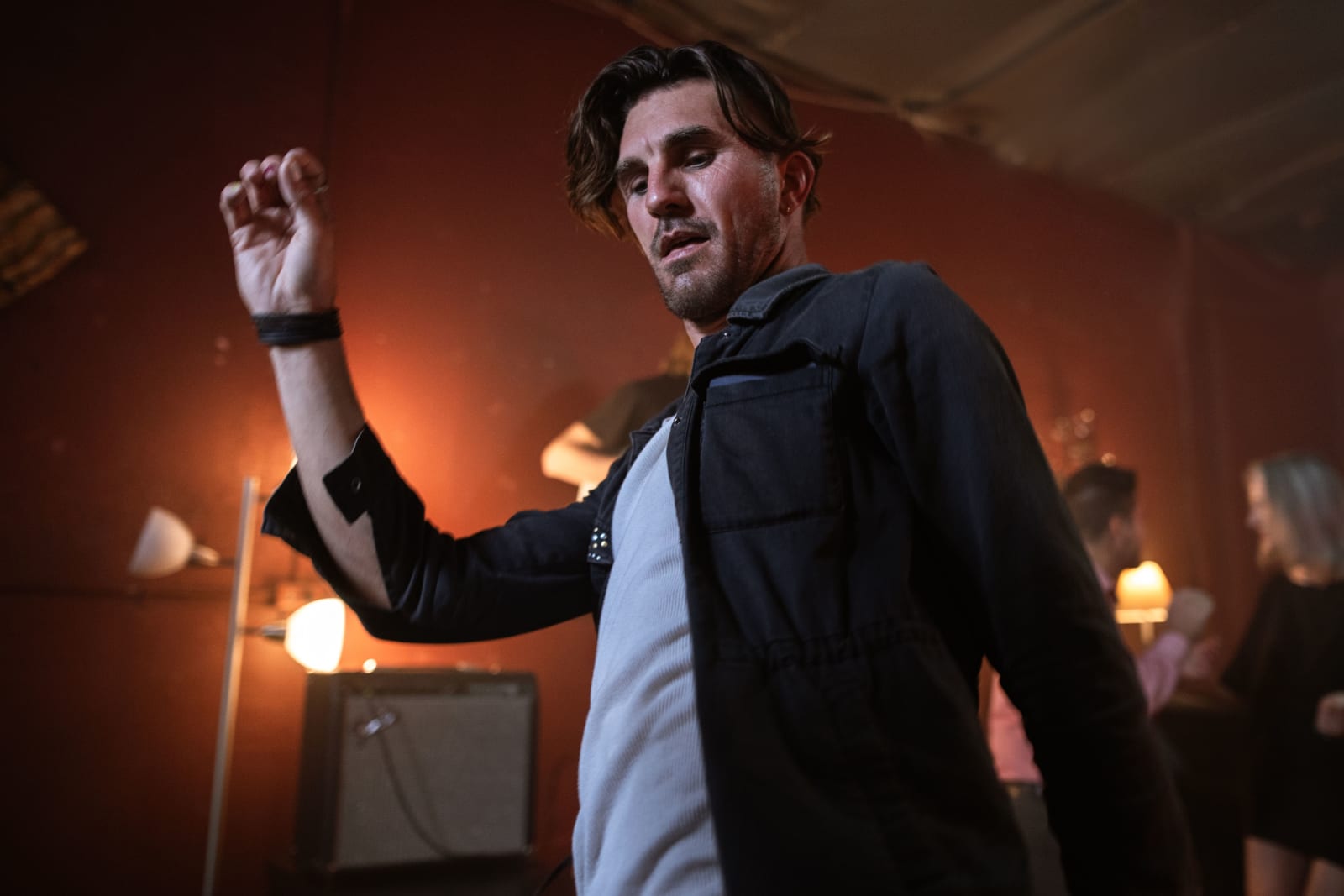 A man is dancing at a club.