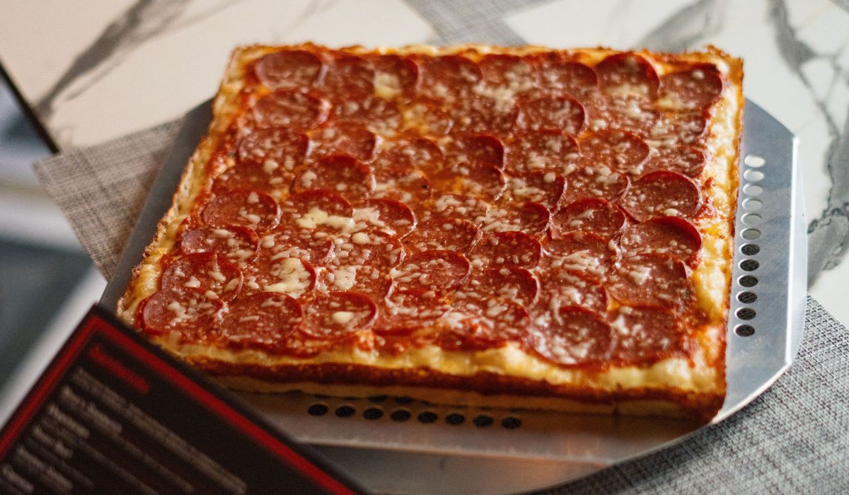 Square pepperoni pizza on table. (Representative Image Source: Pexels | Khezez)