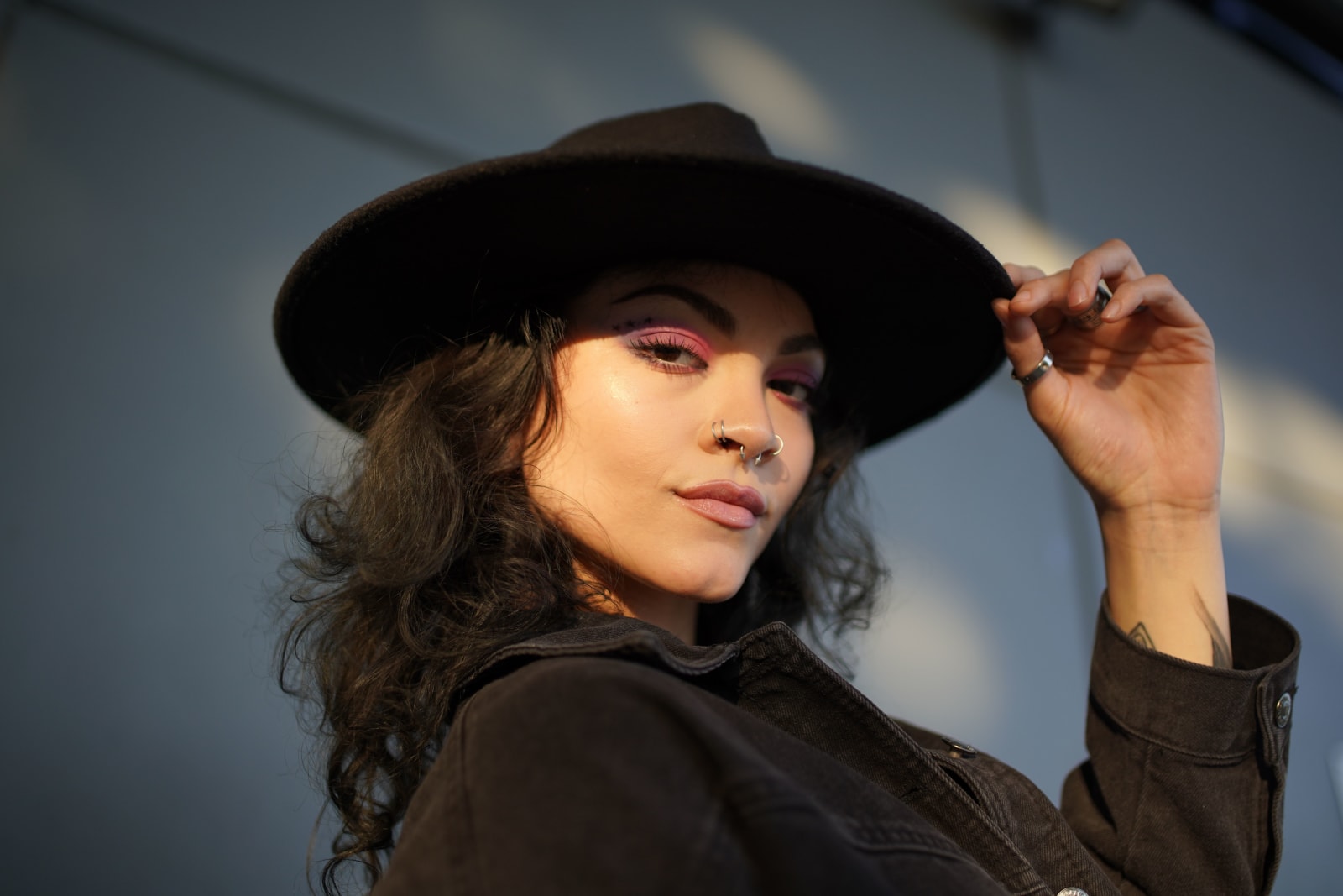 A woman dressed in black is traveling.