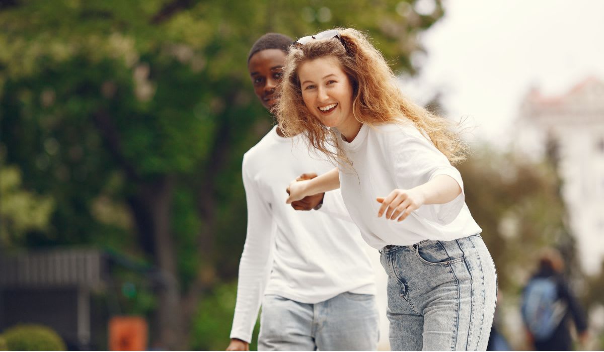A happy couple playfully enjoying each other’s company. (Representative Image Source: Pexels | Gustavo Fring)