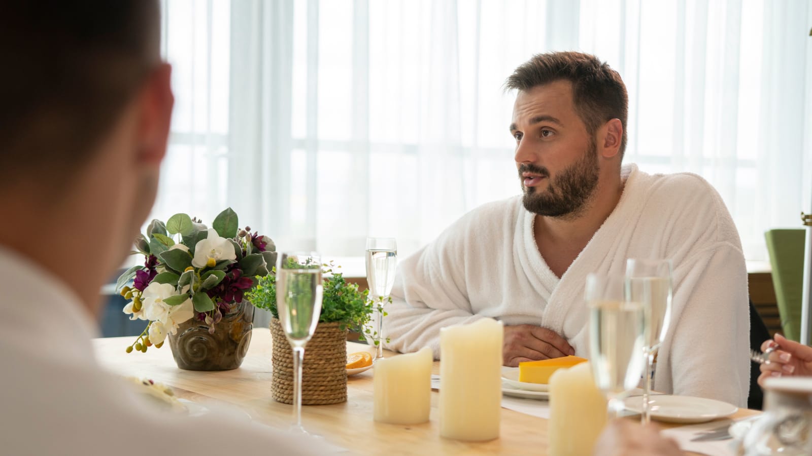 A man speaking at a restaurant.