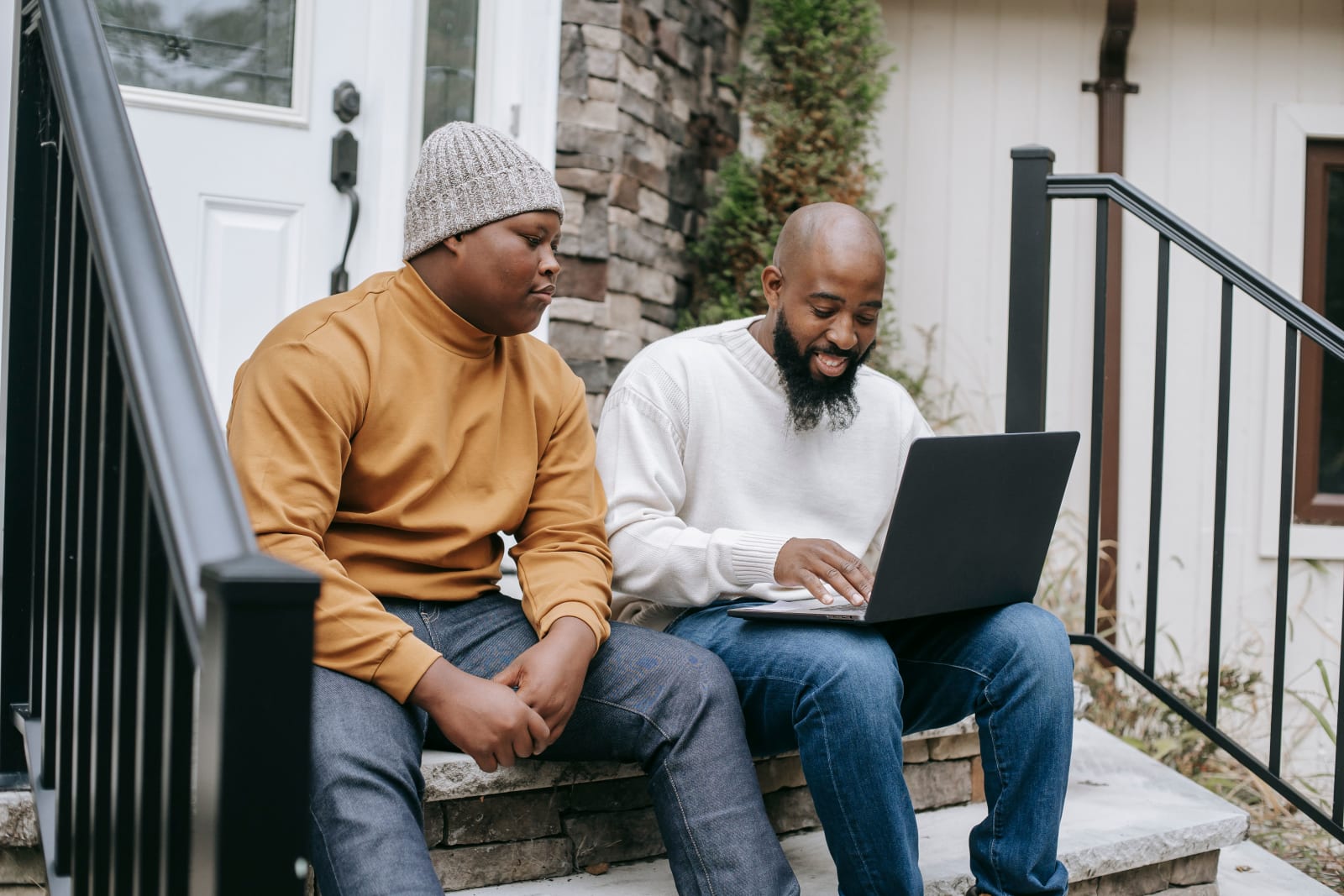 A dad is having a conversation with his teen son.