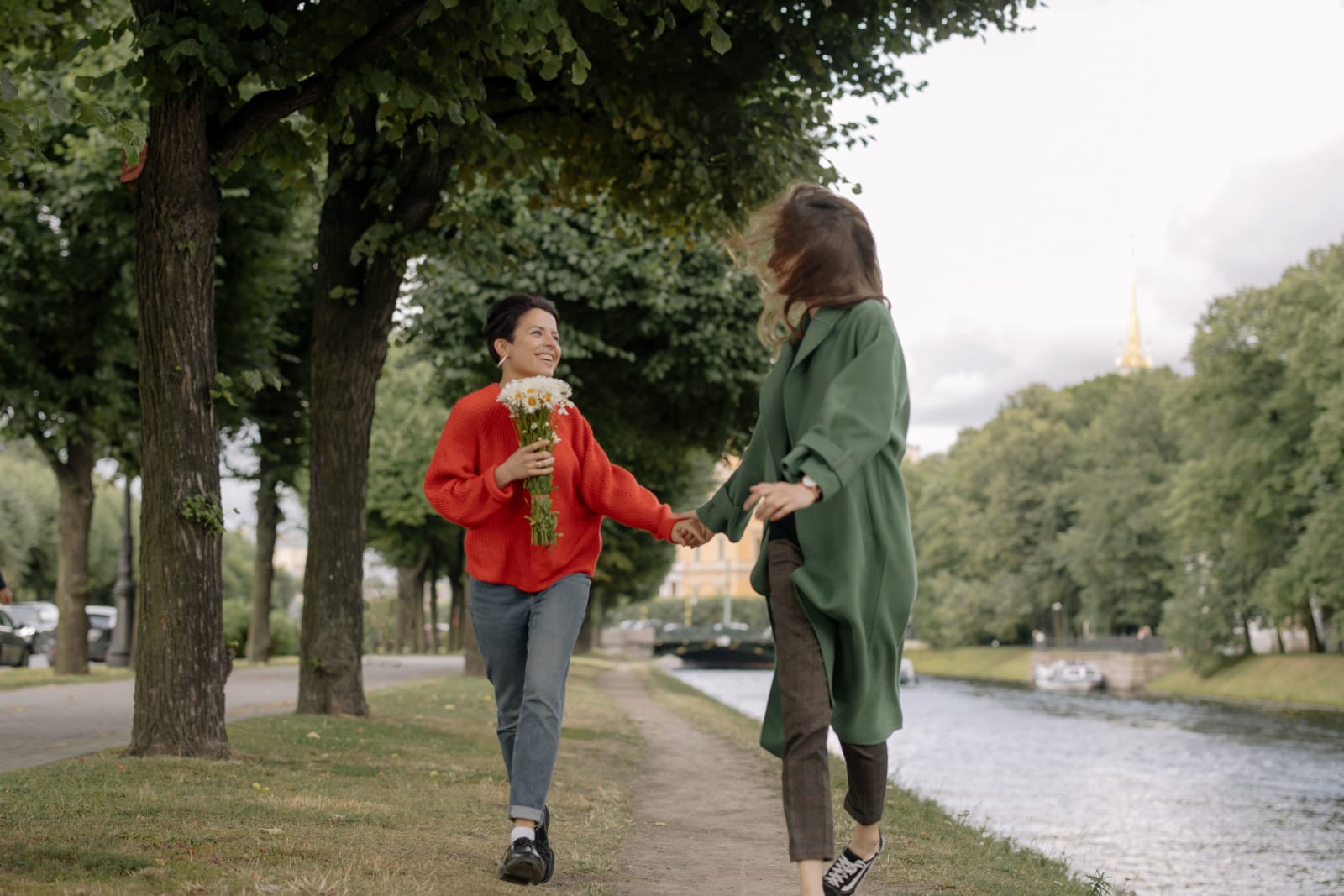 A joyful lesbian couple walking in a park (Representative Image Source: Pexels | cottonbro studio)