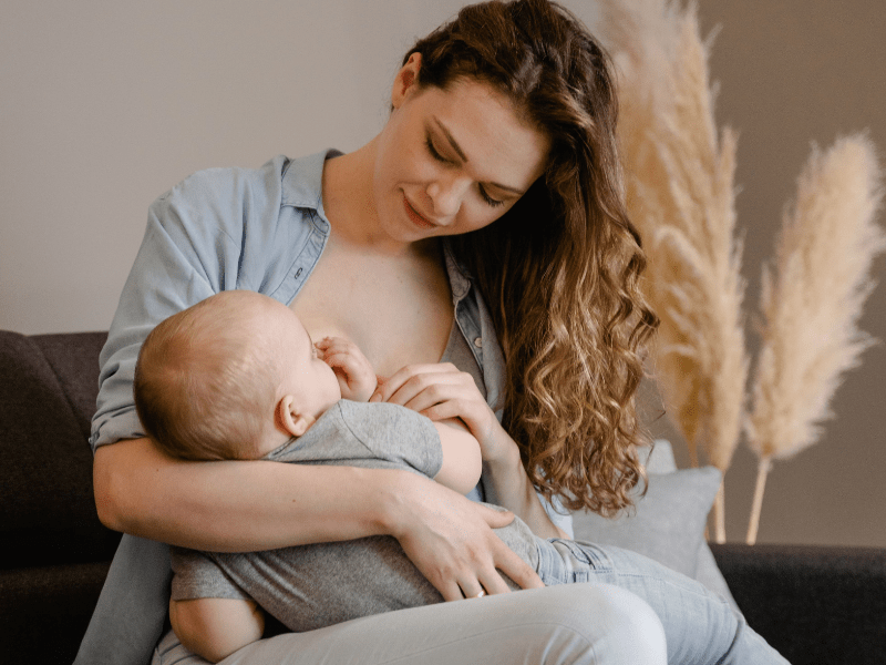 A woman breastfeeding her baby.