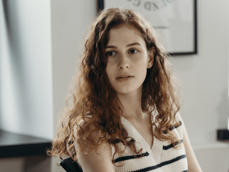 Woman seemingly furious looking at someone.