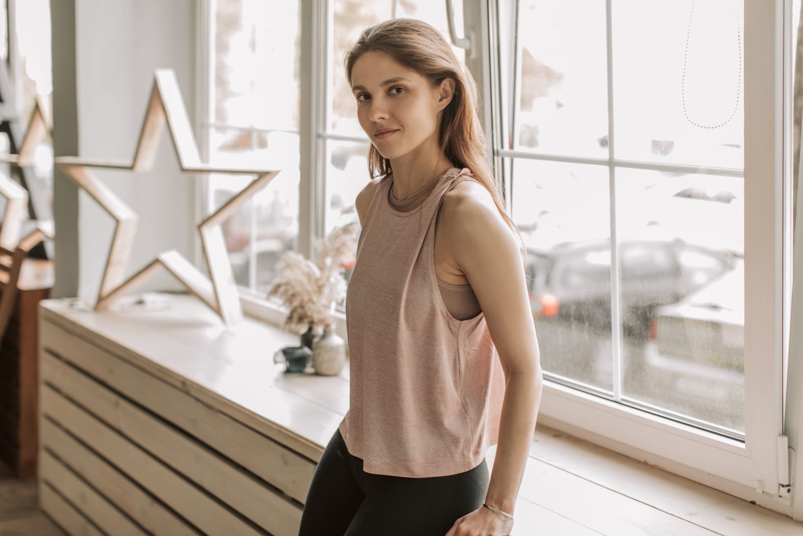 A teenage girl on her balcony.
