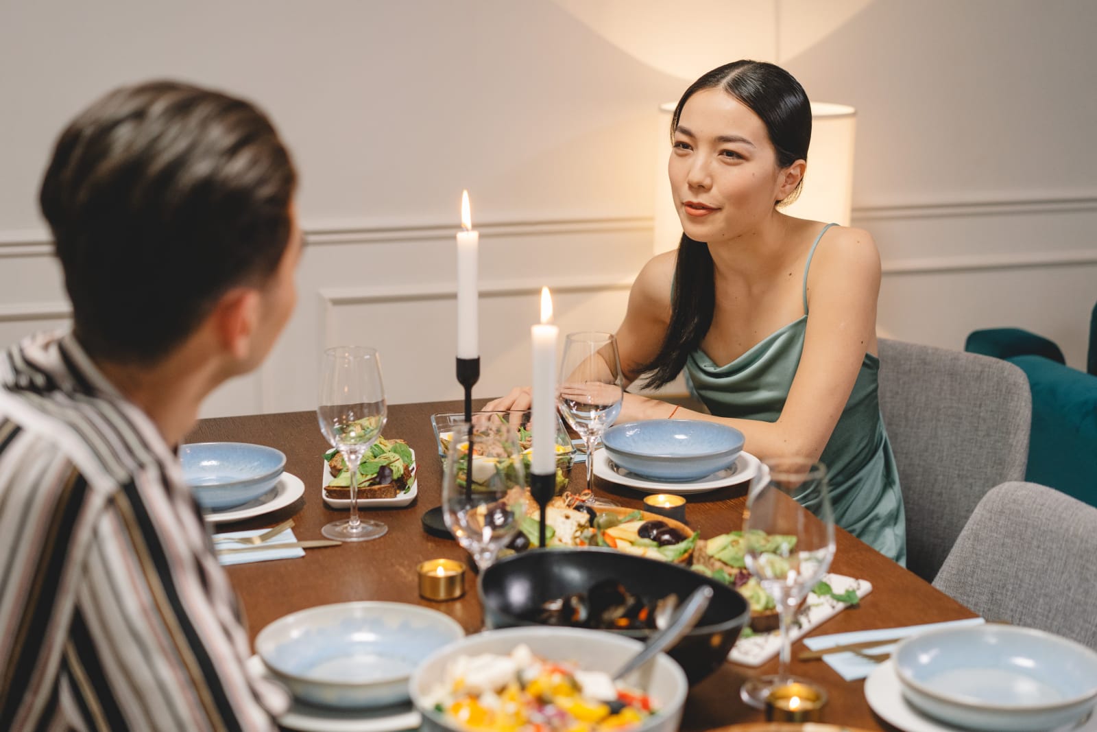 A woman looks confused and shocked while on a date.