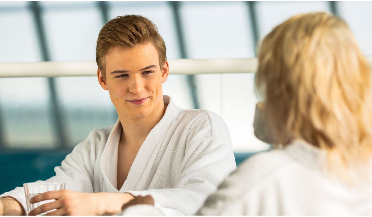 A man talks to a woman at a pool. (Representative Image Source: Pexels | Sergey Torbik)