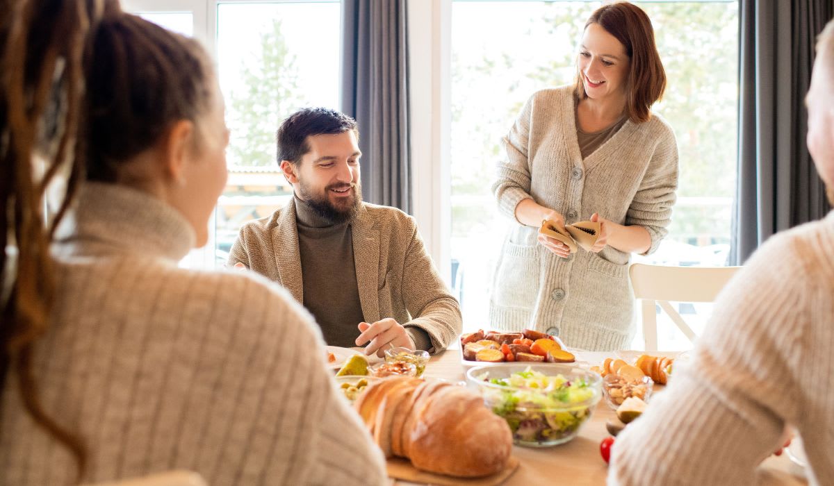 Family sharing a joyful meal. (Representative Image Source: Pexels | Alexy Almond)