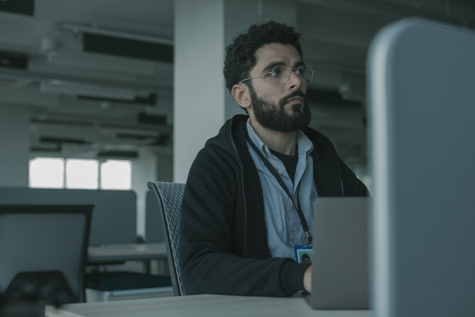 An employee working alone in an office.