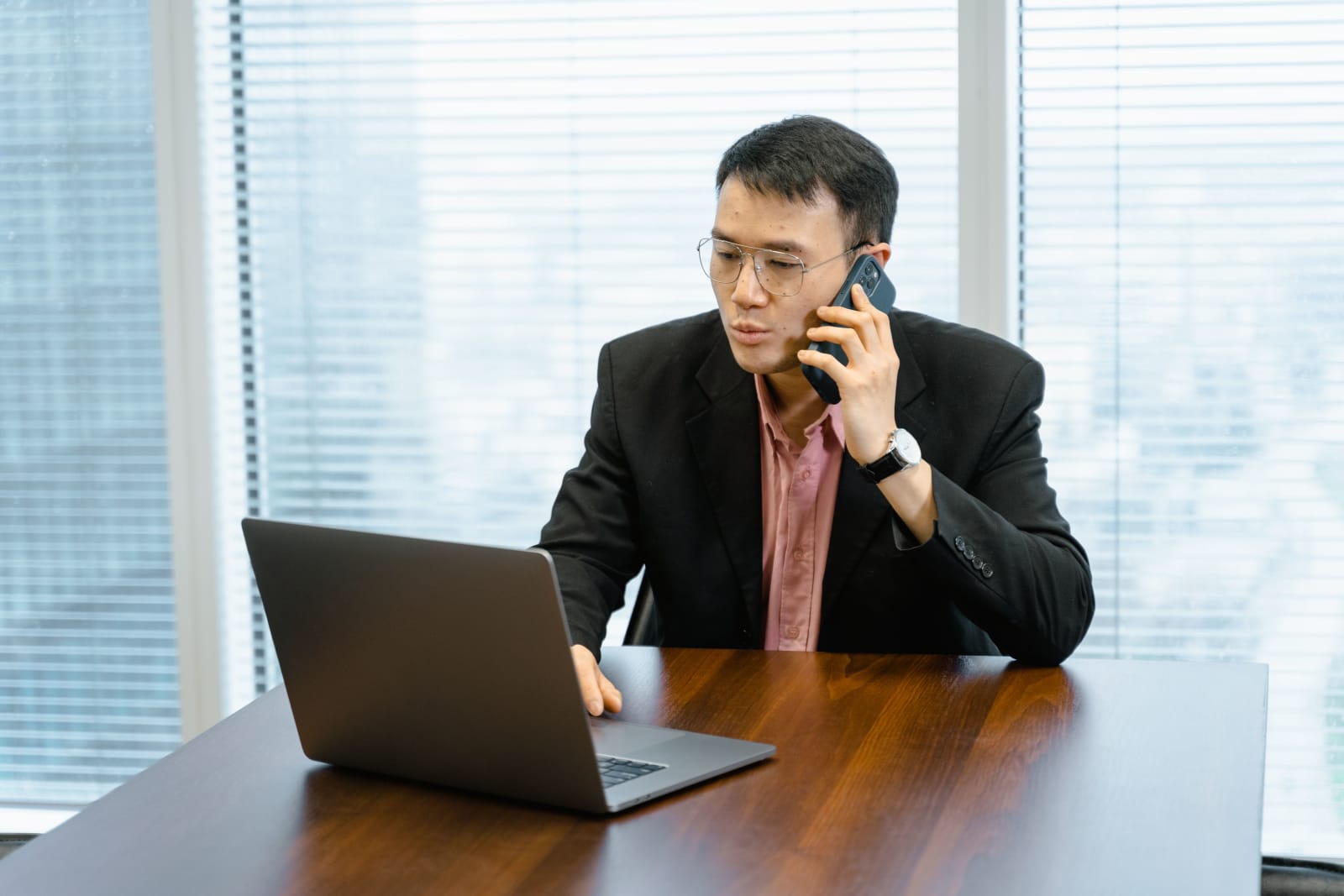 An employee looks serious while speaking to customer.