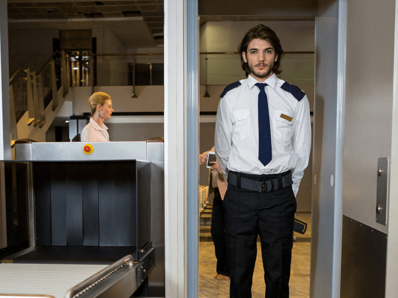 Staff standing at the airport security.