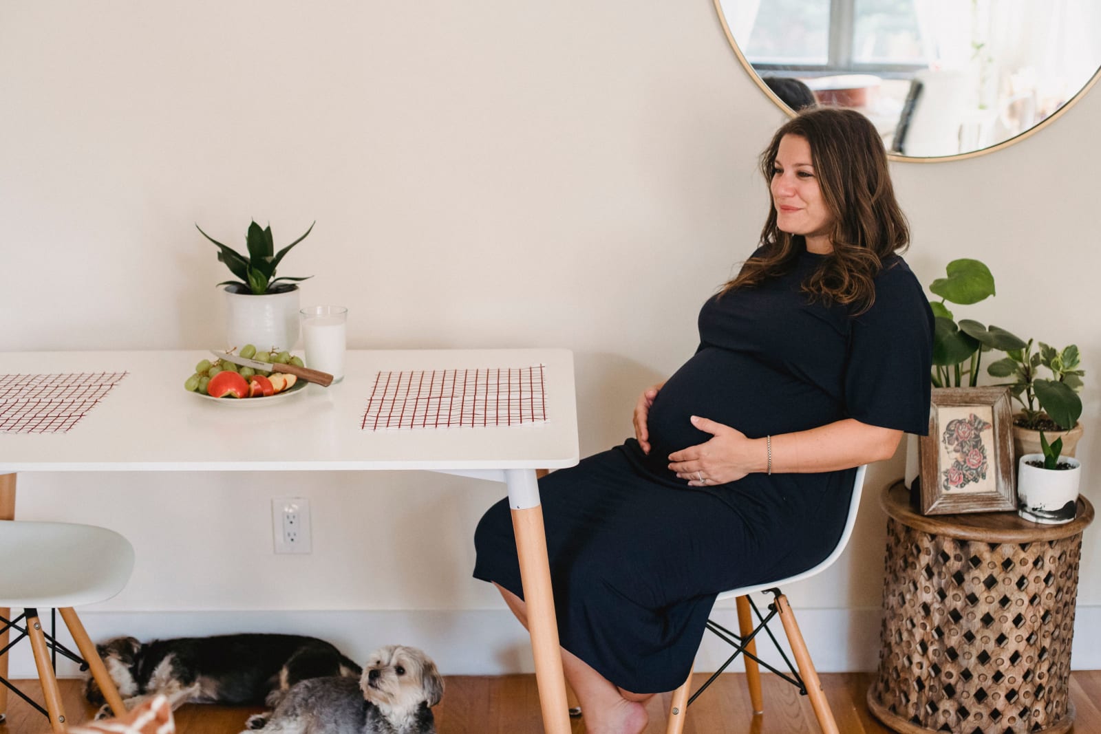 A pregnant woman eating.