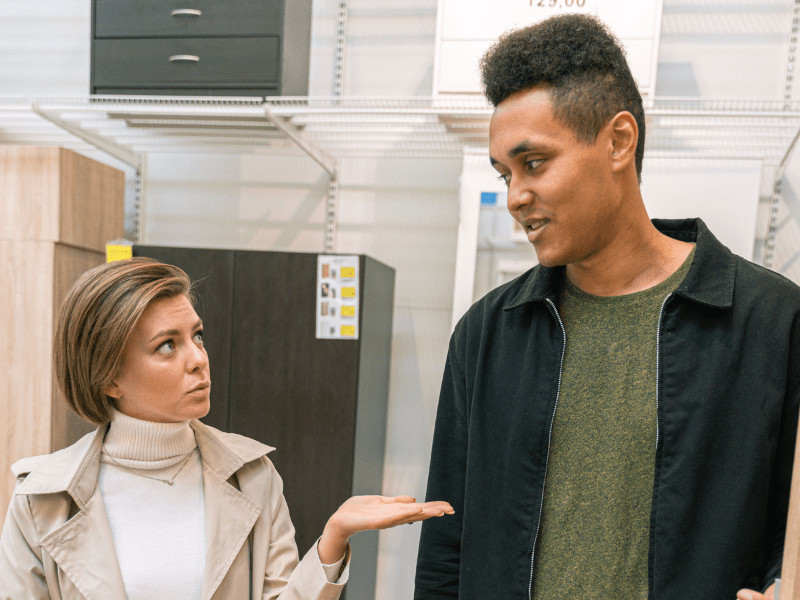 A salesperson showing a product to the customer.