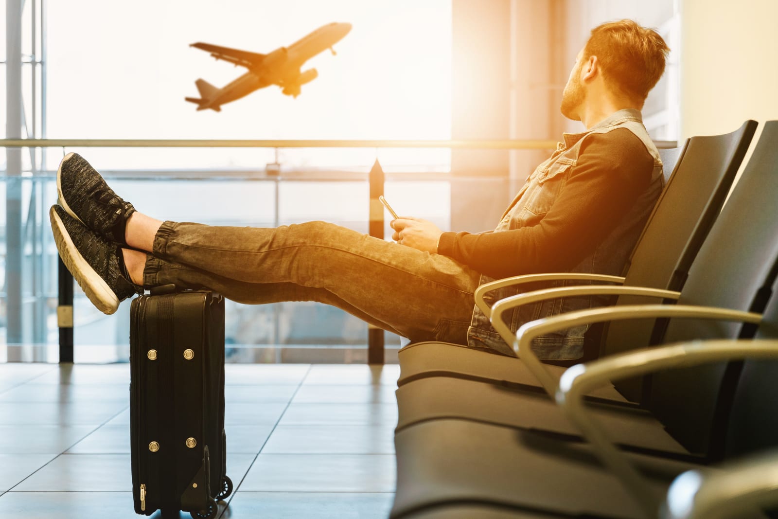A man sitting at the airport.