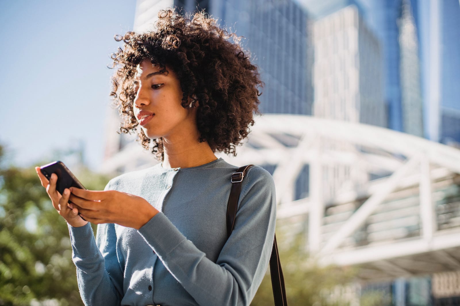 A woman is looking at something on her phone. (Representative Image Source: Pexels| Roberto Hund)