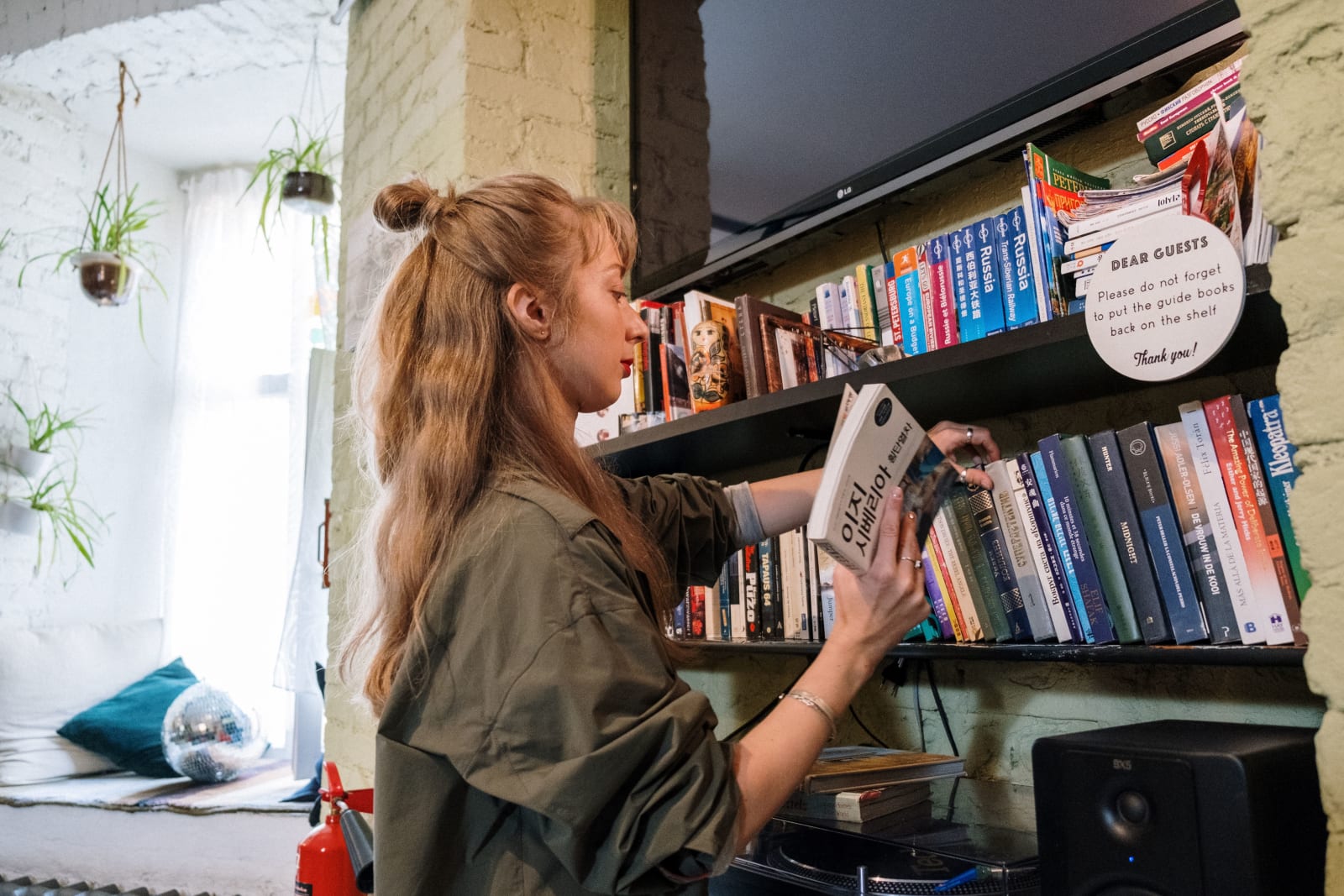 A woman is arranging books in a bookstore. (Representative Image Source: Pexels| cottonbro studio)