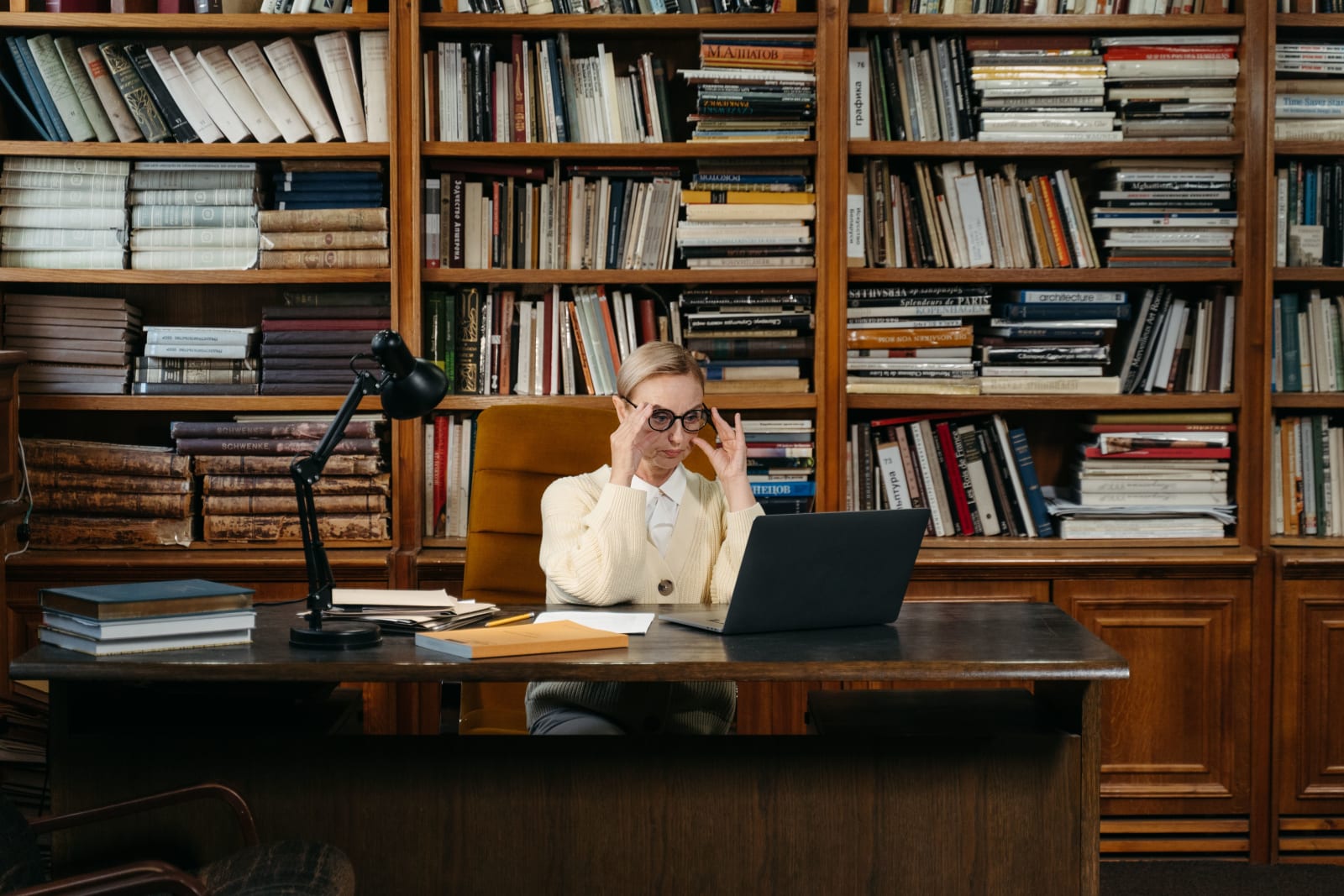 A manager at a bookstore looking at something intently. (Representative Image Source: Pexels| Tima Miroshnichenko)