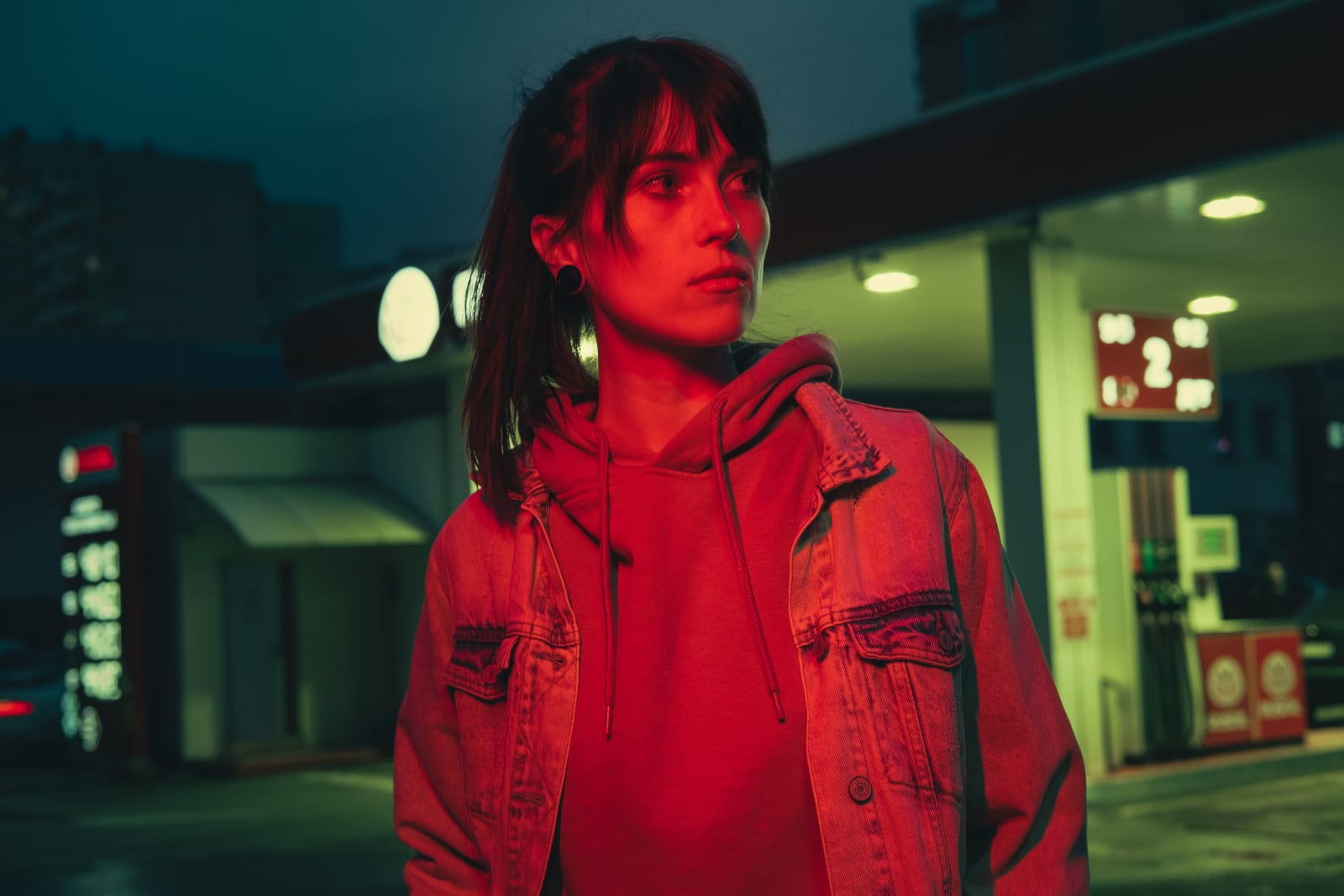 A woman looks alert and worried while out at night. (Representative Image Source: Pexels| Dmitry)