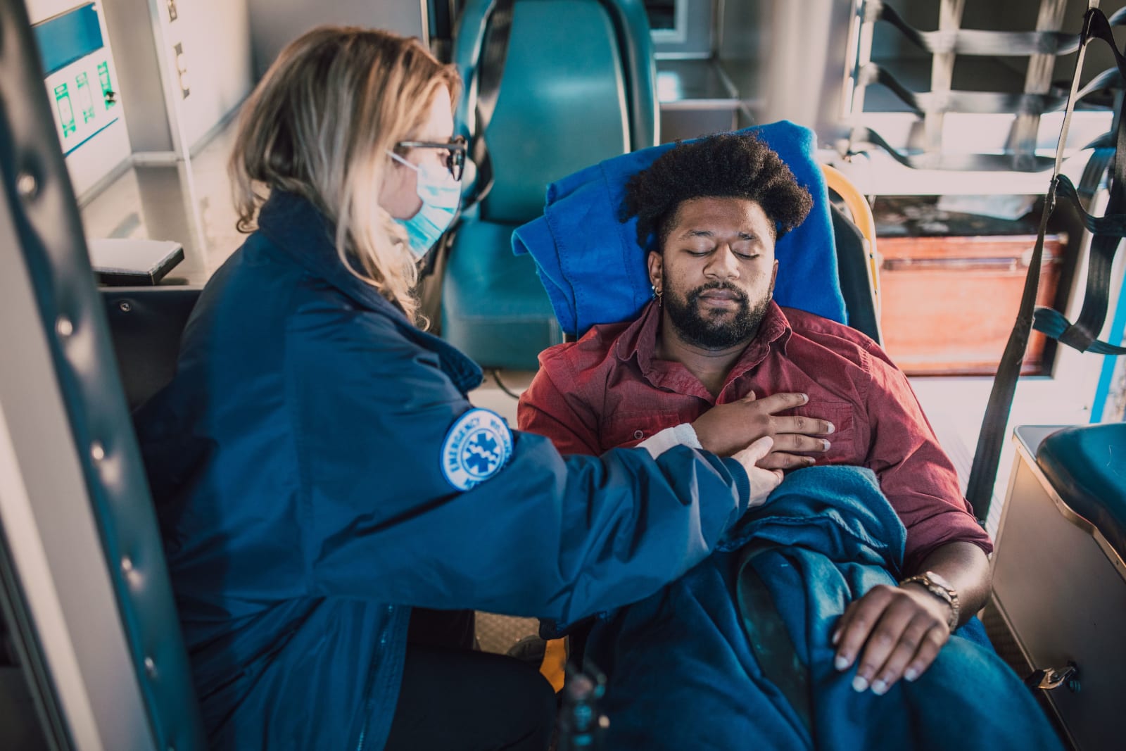 A paramedic attends to an injured man in an ambulance (Representative Image Source: Pexels | RDNE Stock project)