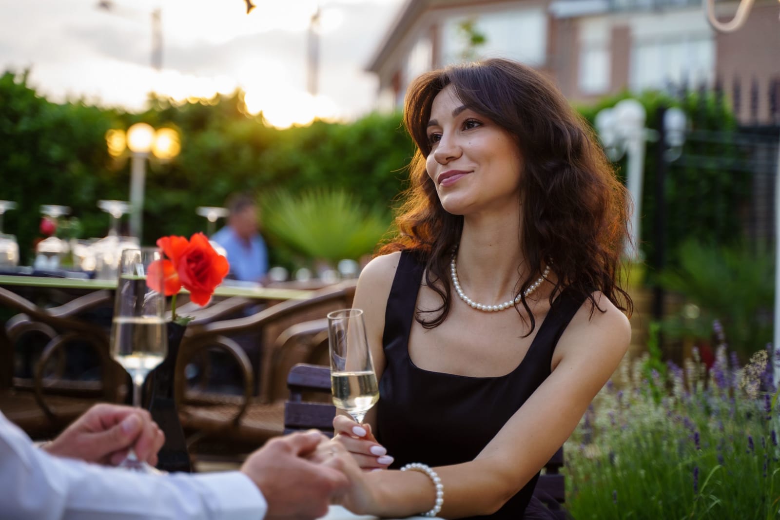 A woman smiling while on a date at a restaurant. (Representative Image Source: Pexels| Boris Ivas)