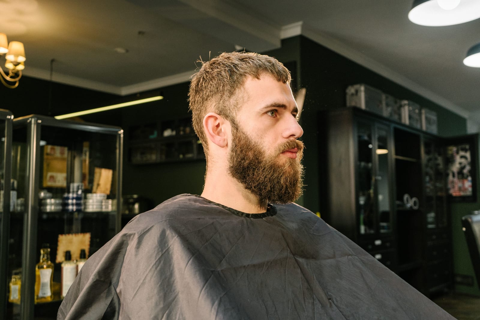 A man looking at himself in the mirror after getting haircut. (Representative Image Source: Pexels| Shkraba Antoni)