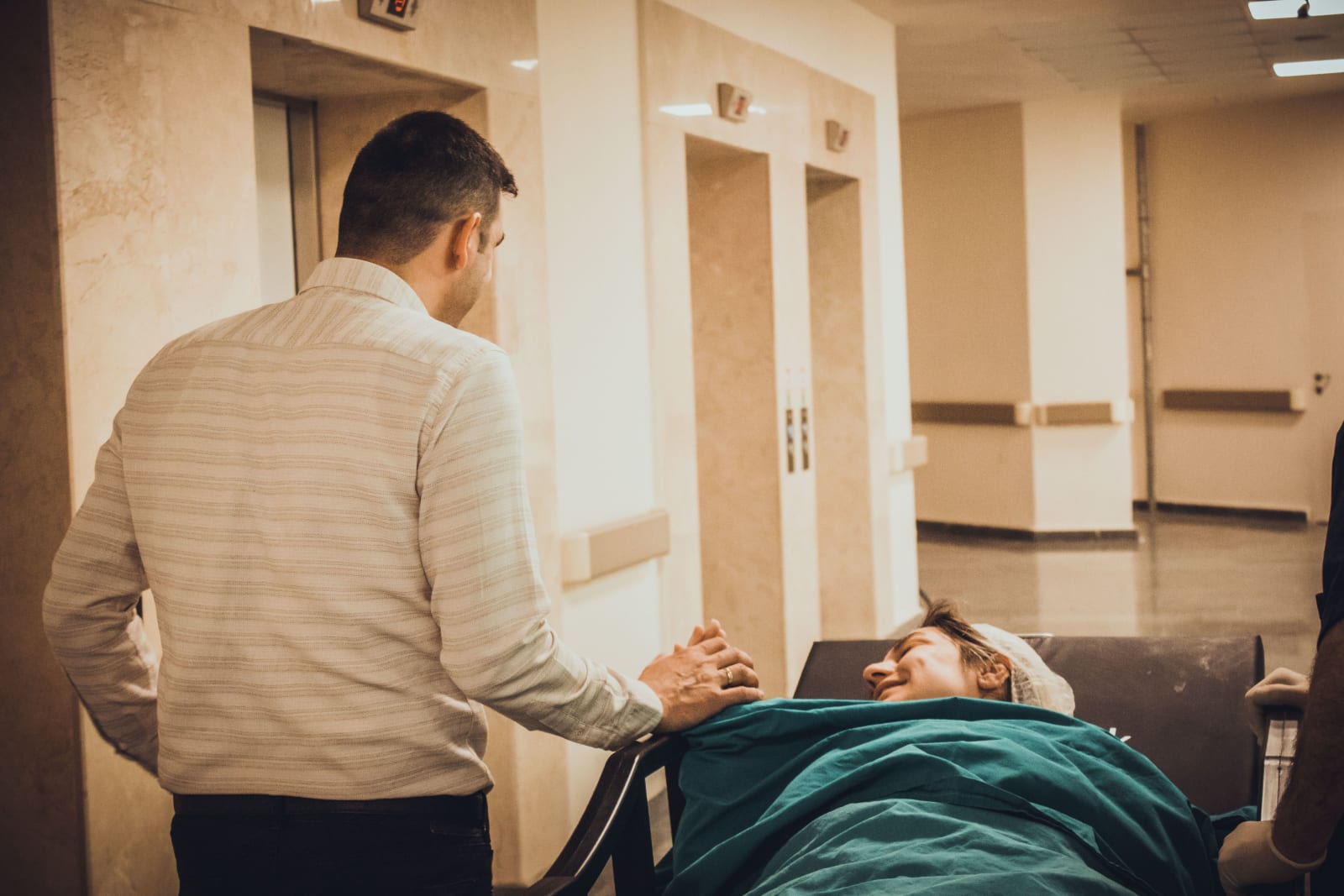 Man supporting his wife during labor.