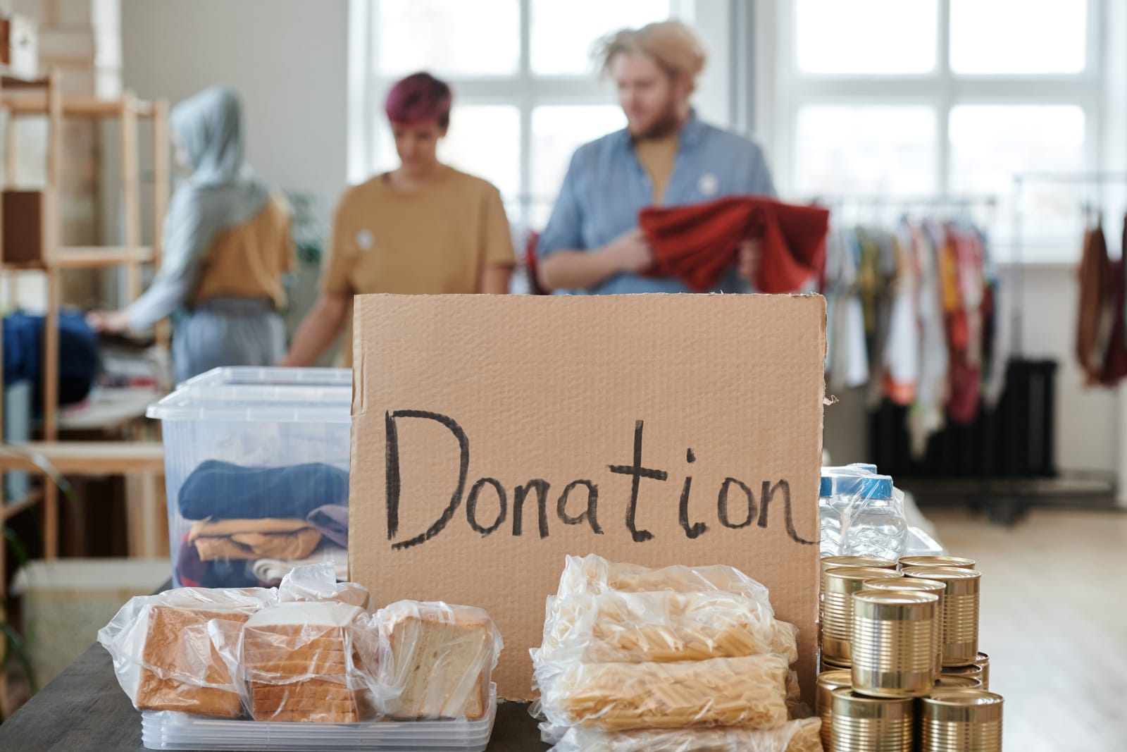 Volunteers at a food bank with donated f