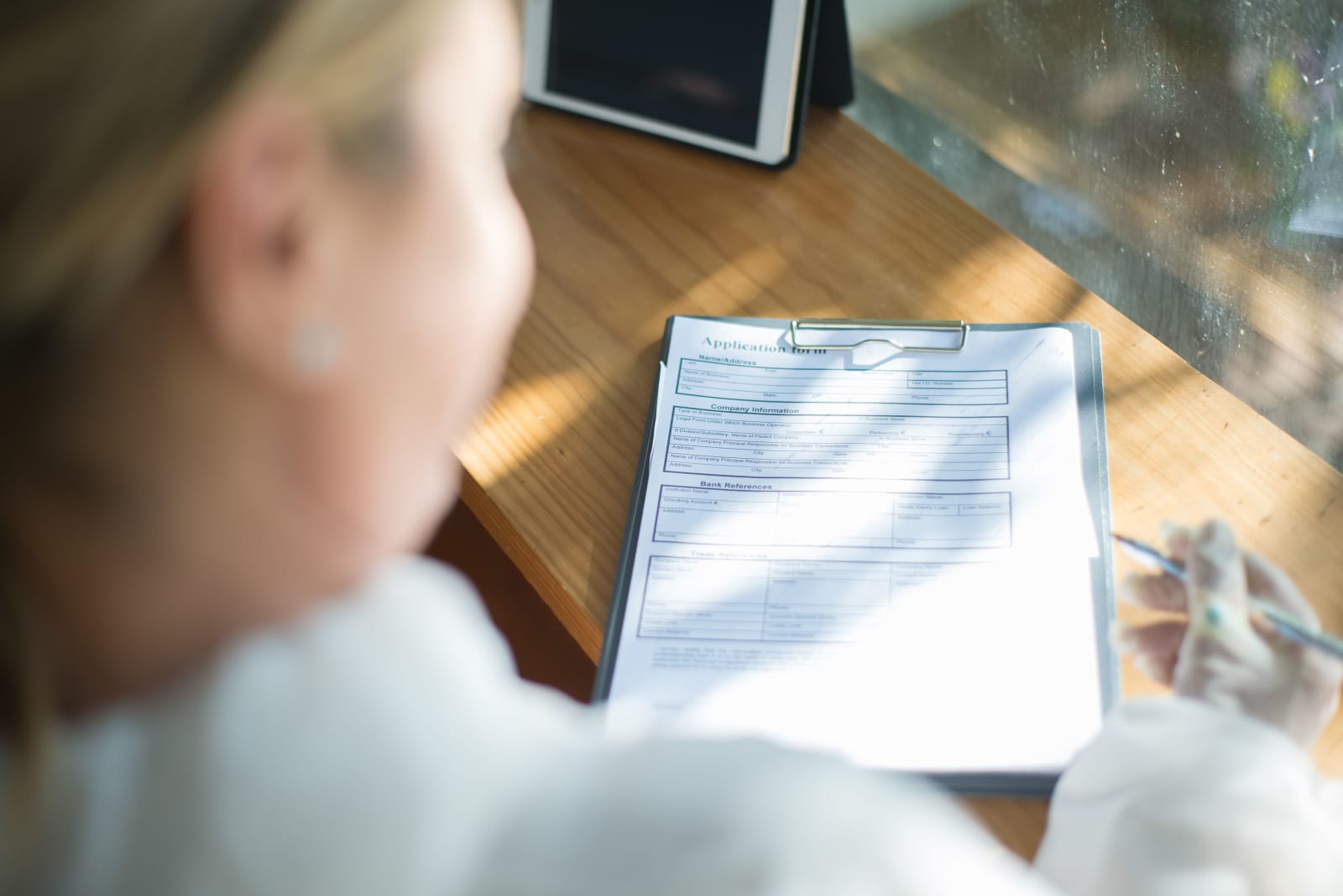 A woman filling a form. (Representative Image Source: Pexels| Kampus Production)