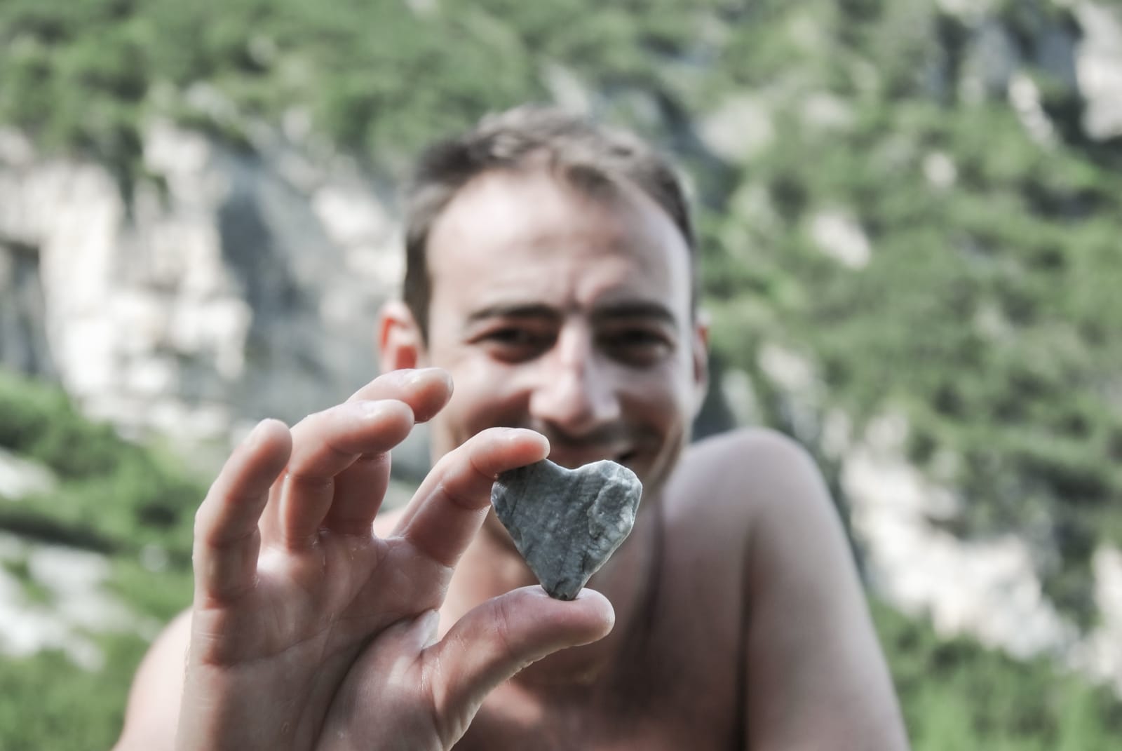 A man holding heart-shaped rock. (Representative Image Source: Pexels| Francesco Sommacal)