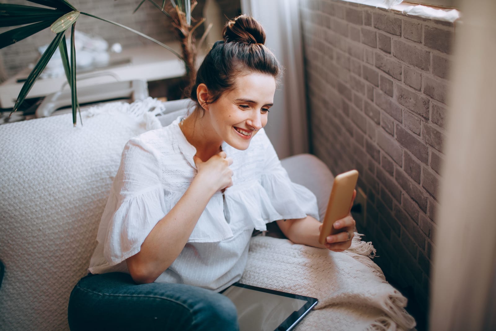 A woman looks emotional after looking at phone. (Representative Image Source: Pexels| Helena Lopes)